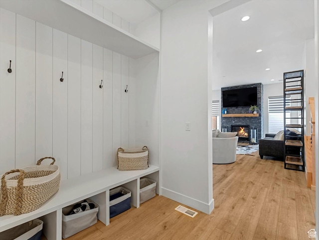 5796 N Valley View Rd, Lehi, UT 84043 - mudroom featuring light wood-style floors, a large fireplace, and recessed lighting