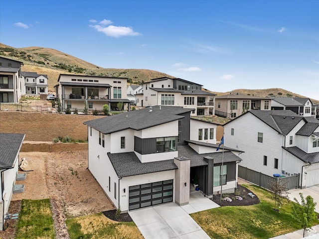 5796 N Valley View Rd, Lehi, UT 84043 - view of front of house featuring a residential view, concrete driveway, a mountain view, and an attached garage