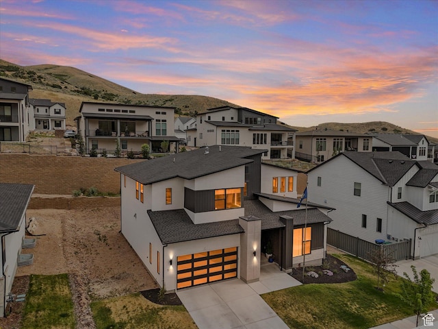 5796 N Valley View Rd, Lehi, UT 84043 - view of front of house featuring concrete driveway, a garage, a residential view, and a mountain view