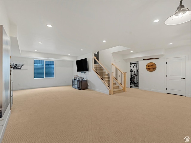 5796 N Valley View Rd, Lehi, UT 84043 - unfurnished living room featuring light colored carpet, stairs, and recessed lighting