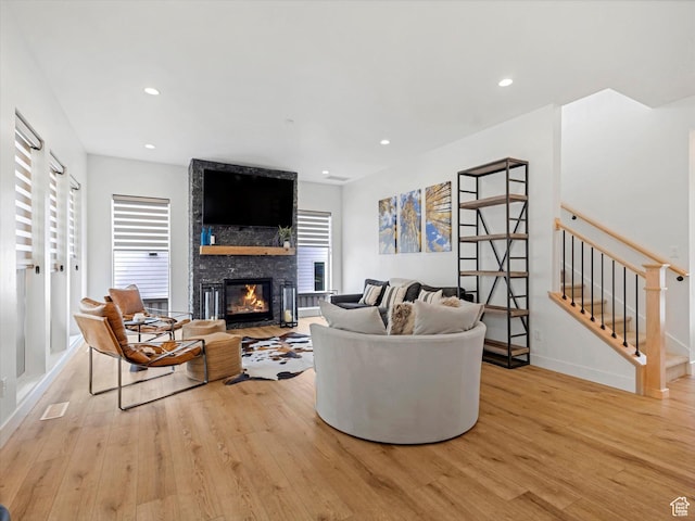5796 N Valley View Rd, Lehi, UT 84043 - living room with light wood-type flooring, a large fireplace, recessed lighting, and stairway