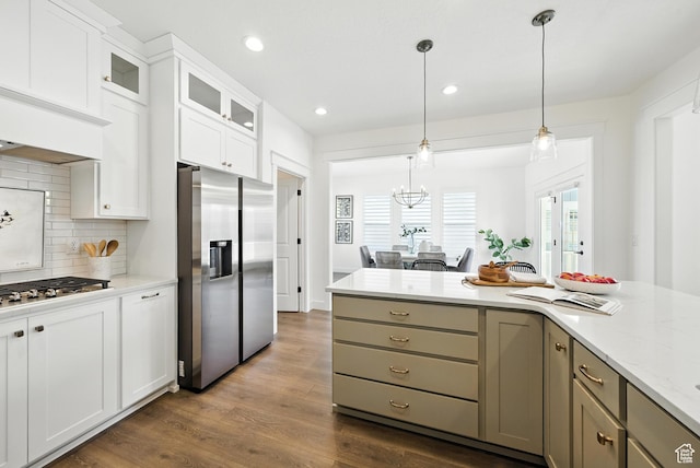 6331 W Copper Hawk Dr, South Jordan, UT 84009 - kitchen featuring stainless steel appliances, decorative backsplash, dark wood-style flooring, glass insert cabinets, and hanging light fixtures