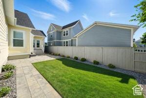 6331 W Copper Hawk Dr, South Jordan, UT 84009 - fenced backyard with a patio and entry steps