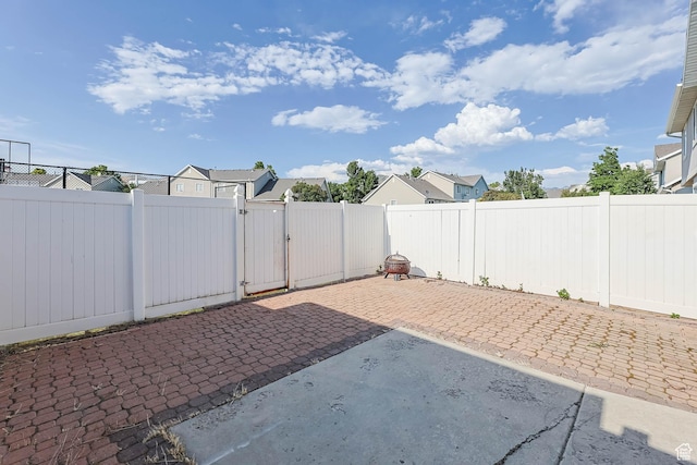 3152 W Davencourt Loop, Lehi, UT 84043 - fenced backyard with a gate, a patio, and a residential view