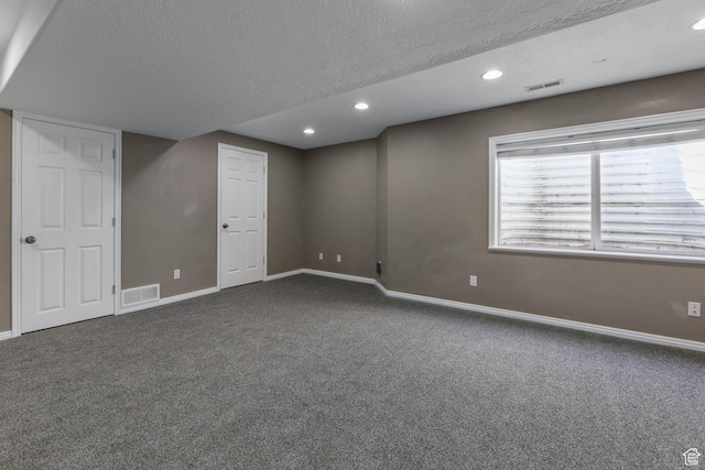 3152 W Davencourt Loop, Lehi, UT 84043 - basement with dark carpet, a textured ceiling, and recessed lighting