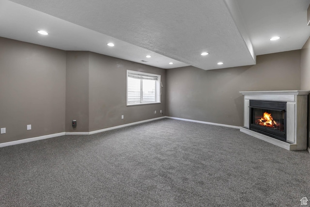 3152 W Davencourt Loop, Lehi, UT 84043 - below grade area featuring carpet, recessed lighting, a glass covered fireplace, and a textured ceiling