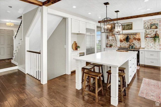 955 Mink Cir N, Salt Lake, UT 84054 - kitchen with a chandelier, light countertops, recessed lighting, dark wood-type flooring, and white cabinets