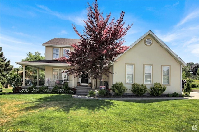 955 Mink Cir N, Salt Lake, UT 84054 - obstructed view of property with a front lawn, stucco siding, and covered porch