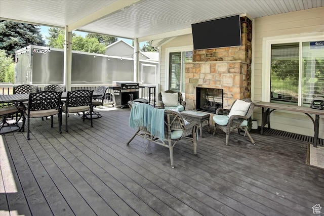 955 Mink Cir N, Salt Lake, UT 84054 - deck featuring an outdoor fireplace, outdoor dining space, and a grill