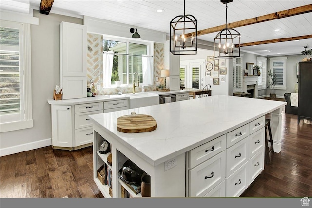 955 Mink Cir N, Salt Lake, UT 84054 - kitchen with a wooden ceiling with exposed beams, a center island, white cabinetry, dark wood-style floors, and hanging light fixtures