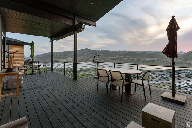 11515 N White Tail Ct, Hideout, UT 84036 - deck with outdoor dining space and a mountain view