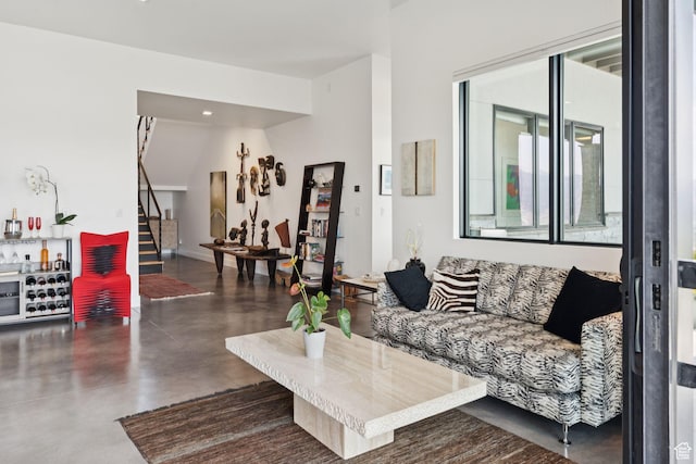 11515 N White Tail Ct, Hideout, UT 84036 - living area featuring stairs, finished concrete floors, a bar, and recessed lighting