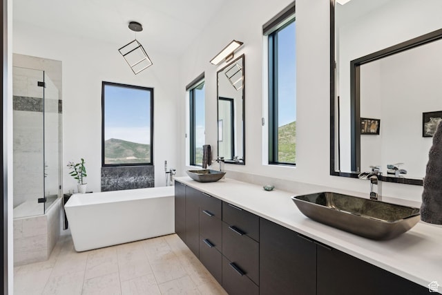 11515 N White Tail Ct, Hideout, UT 84036 - full bath featuring healthy amount of natural light, a soaking tub, a shower stall, and double vanity