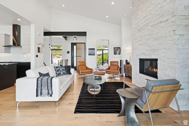 11515 N White Tail Ct, Hideout, UT 84036 - living room featuring a fireplace, high vaulted ceiling, light wood-type flooring, and recessed lighting