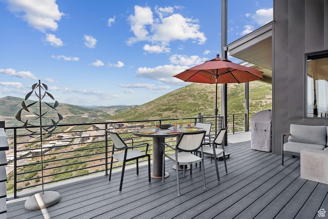11515 N White Tail Ct, Hideout, UT 84036 - wooden deck featuring a mountain view and outdoor dining space