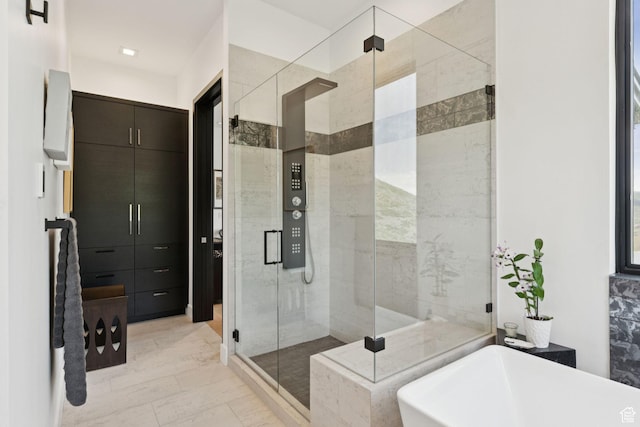 11515 N White Tail Ct, Hideout, UT 84036 - full bathroom with a freestanding bath, a stall shower, and marble finish floors