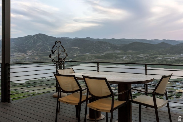11515 N White Tail Ct, Hideout, UT 84036 - wooden deck featuring outdoor dining space and a water and mountain view