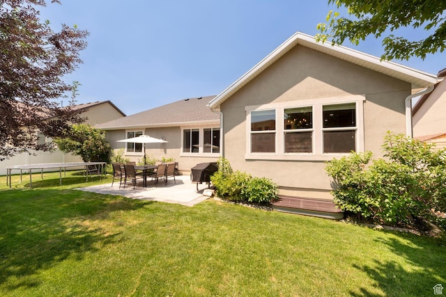 2071 S 500 E, Heber City, UT 84032 - back of house with a patio, stucco siding, a yard, and a trampoline