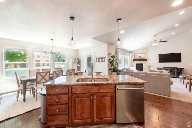 2071 S 500 E, Heber City, UT 84032 - kitchen featuring stainless steel dishwasher, a fireplace, light stone counters, ceiling fan, and plenty of natural light