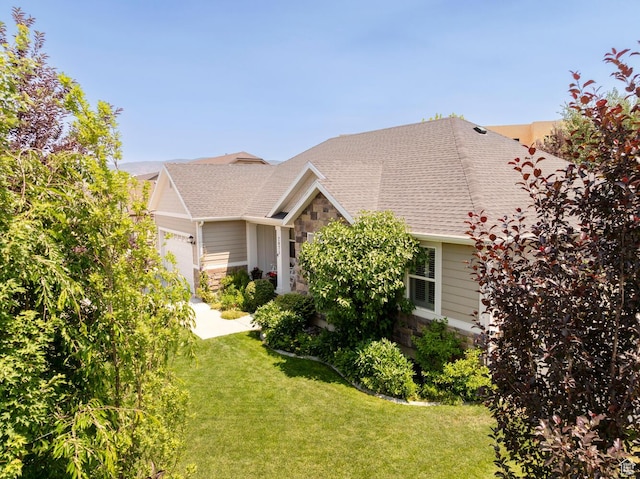 2071 S 500 E, Heber City, UT 84032 - view of front of home with stone siding, a garage, a front lawn, and roof with shingles