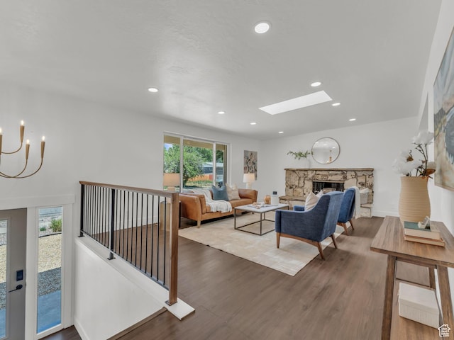 1432 E Colony Dr, Holladay, UT 84117 - living area featuring a chandelier, wood finished floors, a skylight, recessed lighting, and a fireplace