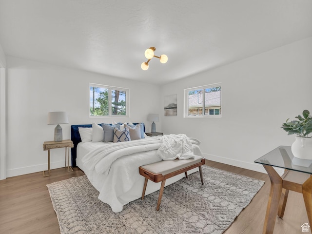 1432 E Colony Dr, Holladay, UT 84117 - bedroom with multiple windows and light wood-type flooring