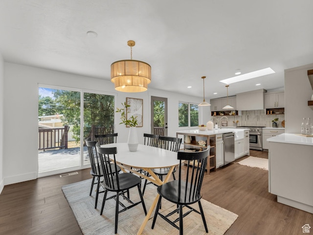 1432 E Colony Dr, Holladay, UT 84117 - dining room featuring healthy amount of natural light, a skylight, recessed lighting, and dark wood-type flooring