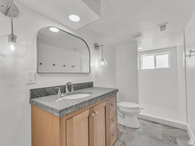 1432 E Colony Dr, Holladay, UT 84117 - bathroom featuring vanity, a tile shower, and marble finish floors