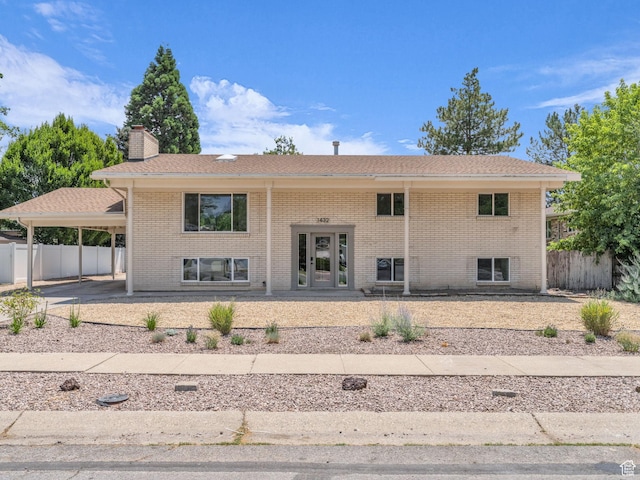 1432 E Colony Dr, Holladay, UT 84117 - back of property with a chimney, brick siding, french doors, and a carport