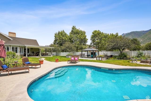 12671 S Somerdowns Ct, Draper, UT 84020 - view of swimming pool featuring a gazebo, a patio area, a fenced backyard, and a mountain view