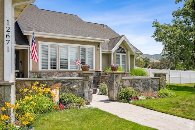 12671 S Somerdowns Ct, Draper, UT 84020 - view of front facade featuring stone siding, stucco siding, a shingled roof, and a mountain view