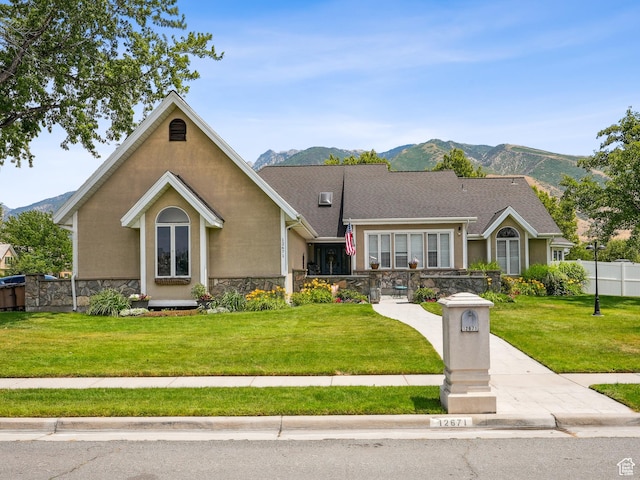 12671 S Somerdowns Ct, Draper, UT 84020 - view of front facade featuring a mountain view, stone siding, and stucco siding