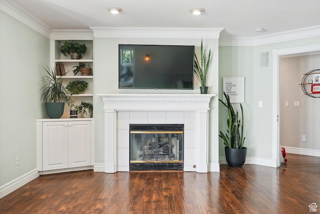 12671 S Somerdowns Ct, Draper, UT 84020 - unfurnished living room featuring ornamental molding, a tiled fireplace, and wood finished floors