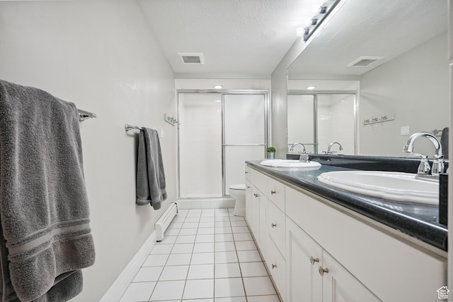 12671 S Somerdowns Ct, Draper, UT 84020 - bathroom featuring a shower stall, double vanity, tile patterned floors, a textured ceiling, and baseboard heating