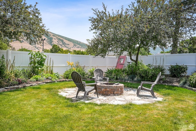 12671 S Somerdowns Ct, Draper, UT 84020 - fenced backyard with an outdoor fire pit and a mountain view