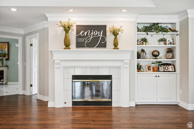 12671 S Somerdowns Ct, Draper, UT 84020 - unfurnished living room with wood finished floors, crown molding, a tile fireplace, and recessed lighting
