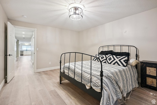 12671 S Somerdowns Ct, Draper, UT 84020 - bedroom featuring light wood-style flooring and a textured ceiling