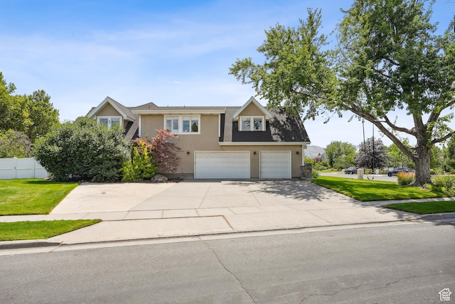 12671 S Somerdowns Ct, Draper, UT 84020 - view of front of property with stucco siding, an attached garage, and driveway