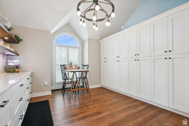 12671 S Somerdowns Ct, Draper, UT 84020 - dining room with lofted ceiling, dark wood finished floors, and a chandelier