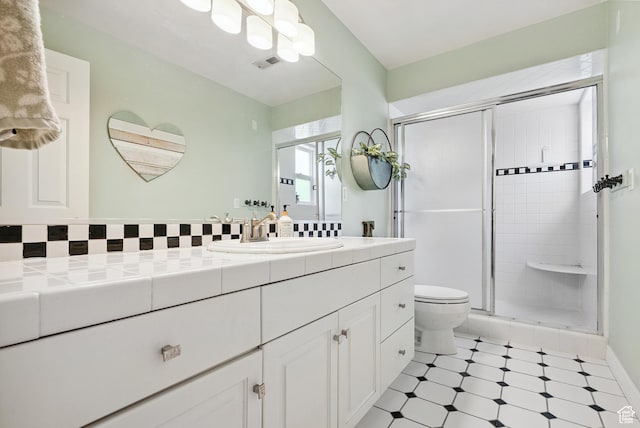 12671 S Somerdowns Ct, Draper, UT 84020 - full bathroom with vanity, a shower stall, tile patterned floors, and decorative backsplash