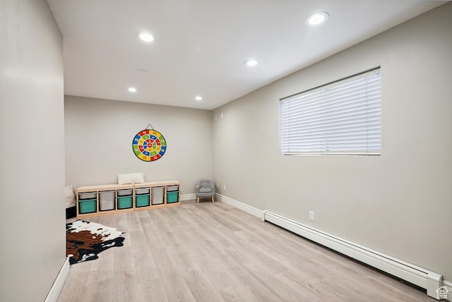 12671 S Somerdowns Ct, Draper, UT 84020 - spare room with a baseboard heating unit, wood finished floors, and recessed lighting