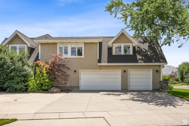 12671 S Somerdowns Ct, Draper, UT 84020 - view of front of property with stucco siding, concrete driveway, and an attached garage