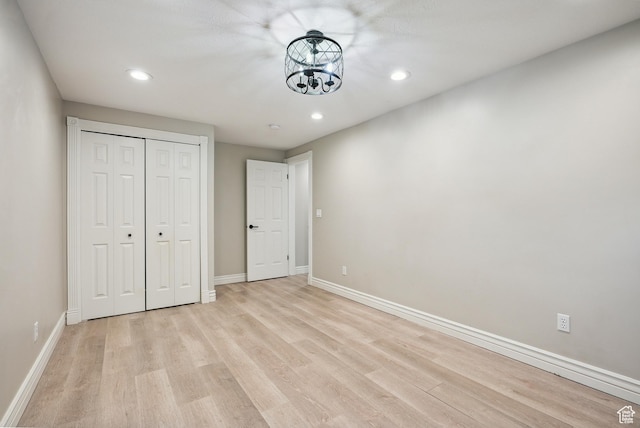 12671 S Somerdowns Ct, Draper, UT 84020 - unfurnished bedroom featuring light wood-style flooring, recessed lighting, and a closet
