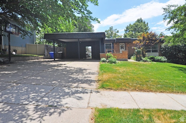136 E 700 S, Farmington, UT 84025 - view of front facade with driveway, brick siding, and mansard roof