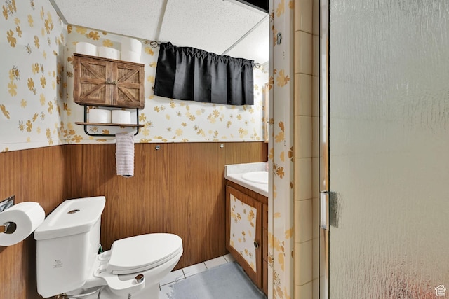 3347 S Rulon St W, Magna, UT 84044 - full bath with wallpapered walls, wainscoting, vanity, a shower stall, and wooden walls