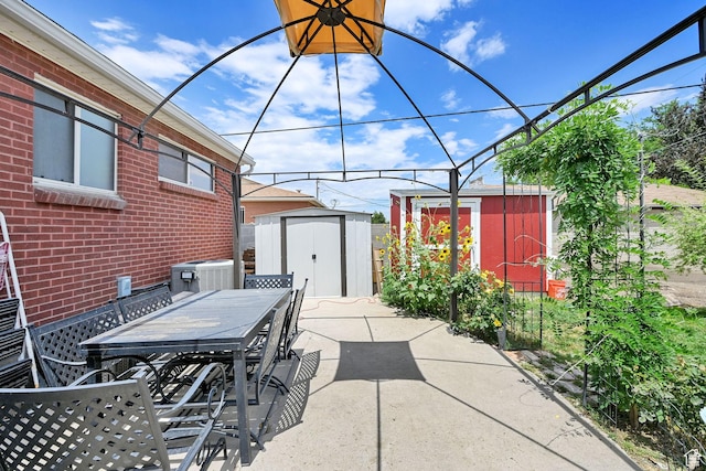 3347 S Rulon St W, Magna, UT 84044 - view of patio / terrace with a storage unit and outdoor dining area