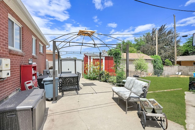 3347 S Rulon St W, Magna, UT 84044 - view of patio with a storage unit and outdoor dining area