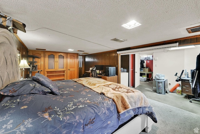 3347 S Rulon St W, Magna, UT 84044 - bedroom with wood walls, concrete floors, and washer / dryer