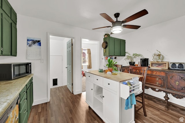 3347 S Rulon St W, Magna, UT 84044 - kitchen with green cabinetry, stainless steel microwave, dark wood-type flooring, and ceiling fan