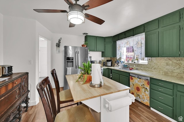 3347 S Rulon St W, Magna, UT 84044 - kitchen featuring green cabinetry, tasteful backsplash, stainless steel fridge, dishwashing machine, and a ceiling fan